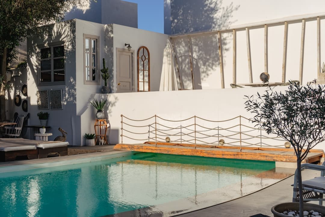 a pool in a backyard - Photo by Kody Goodson on Unsplash